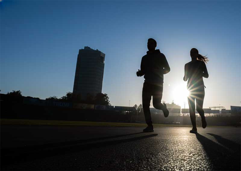 Runner recovering from stress fracture training with crutches