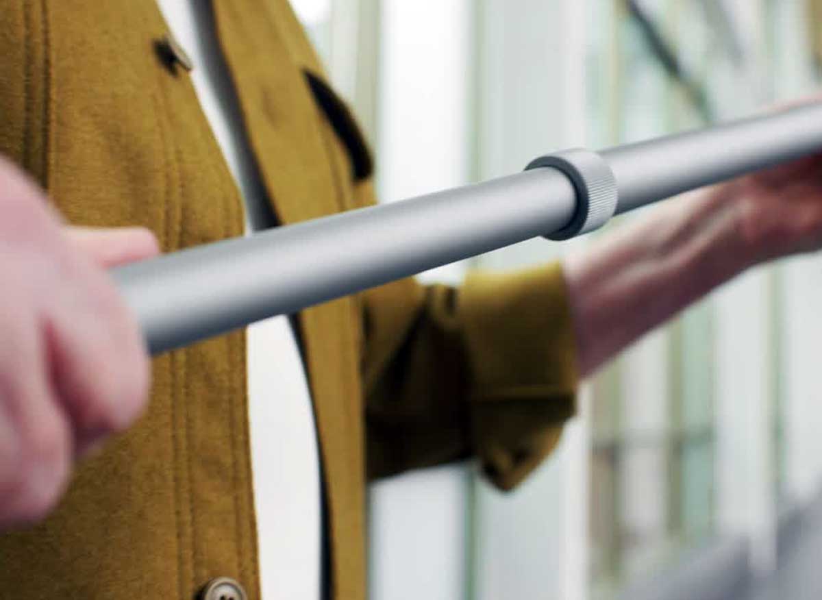 Telo Y Cane height adjustment mechanism showing push button and spring loaded pin system