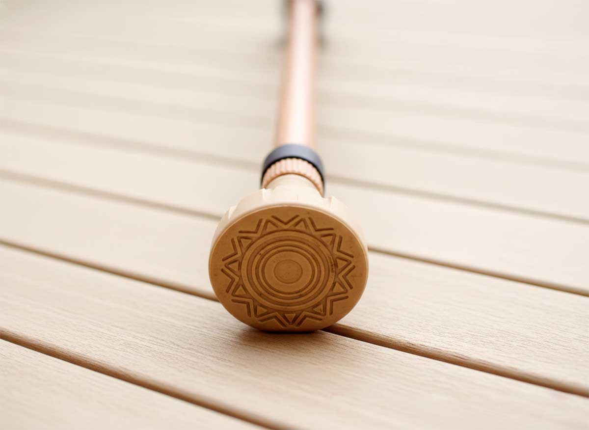 Close up of Telo Y Cane non-slip rubber tip showing tread pattern and replaceable design