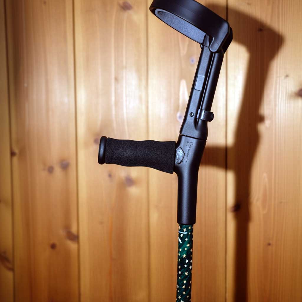 Close up of ergonomic foam handle and padded forearm cuff on Majestick crutches showing grey foam padding and adjustable width