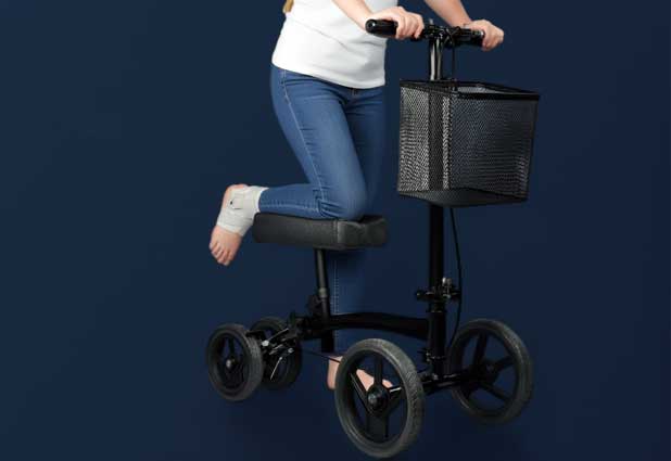 Knee scooter parked near a bright window