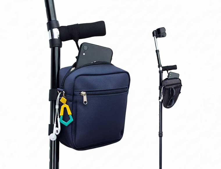 Flat lay of crutch friendly accessories showing crossbody bag, bold earrings, fun socks, and cushioned handle covers
