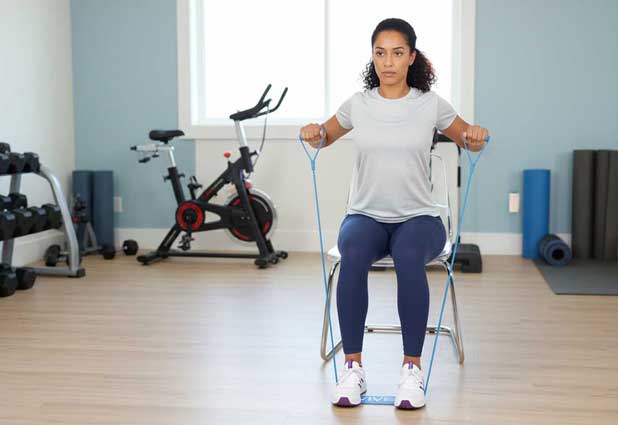 Seated band row performed with an elevated leg supported